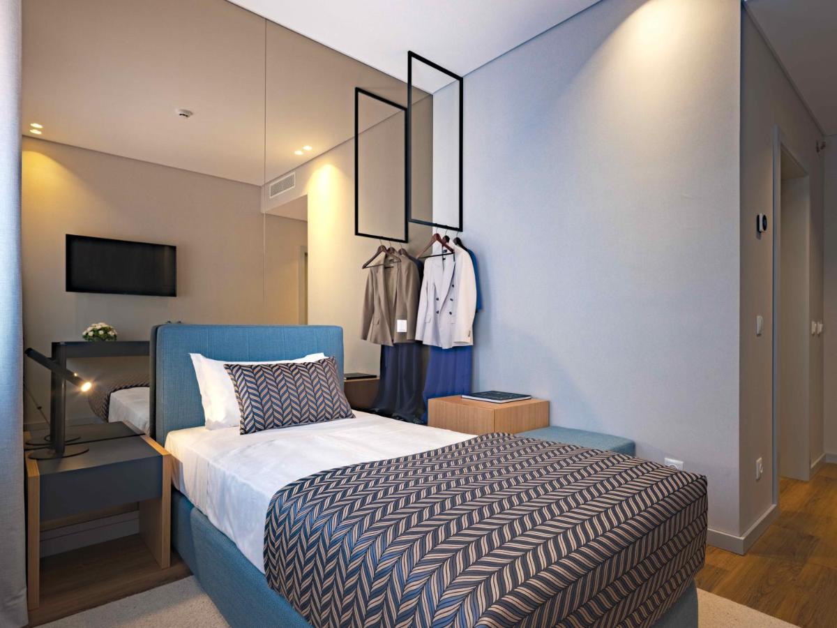 Uma cama ou camas num quarto em Central Monchique Hotel - Villa Termal Spa Resort - by Unlock Hotels