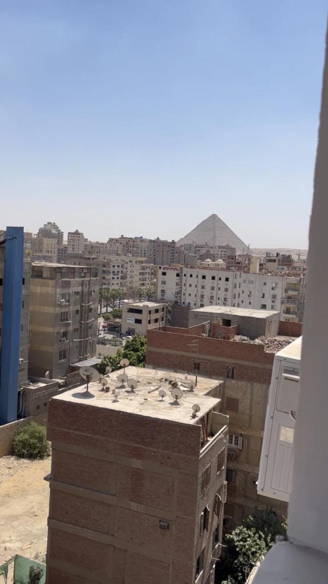 In front of pyramids - Housity