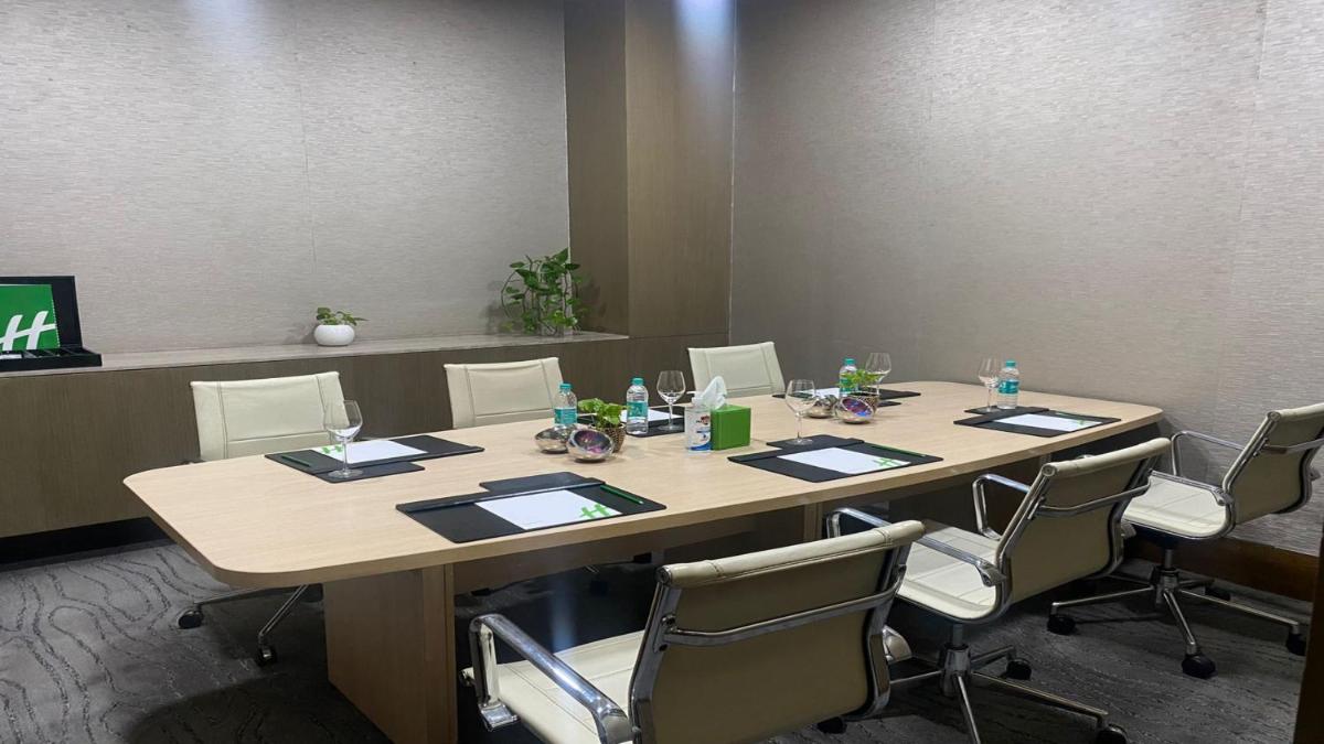 a conference room with a long table and chairs at Holiday Inn New Delhi Aerocity by IHG in New Delhi