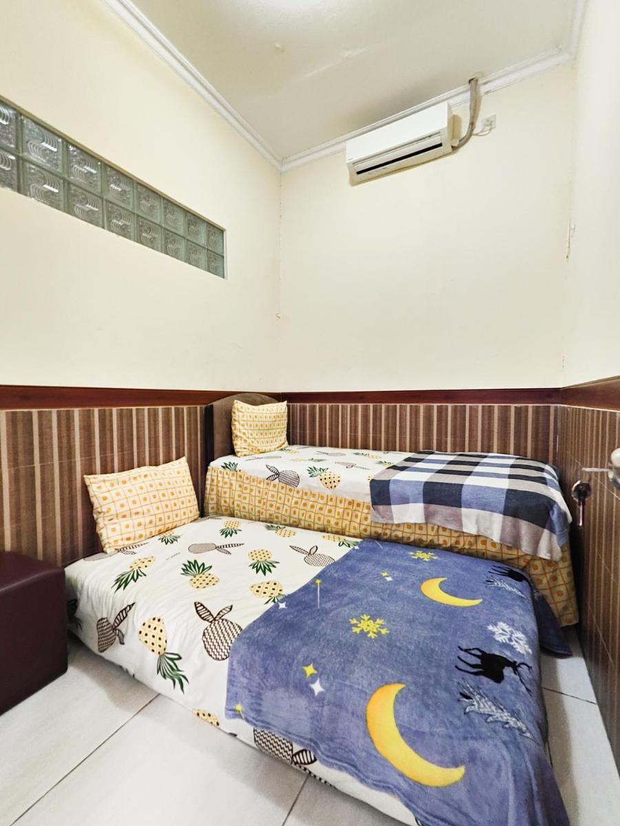 Homey Guesthouse near Sby Zoo Syariah - Housity