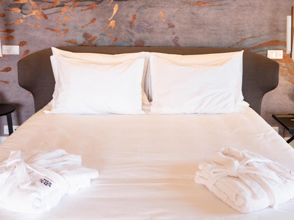 Uma cama ou camas num quarto em Sines Sea View Business & Leisure Hotel