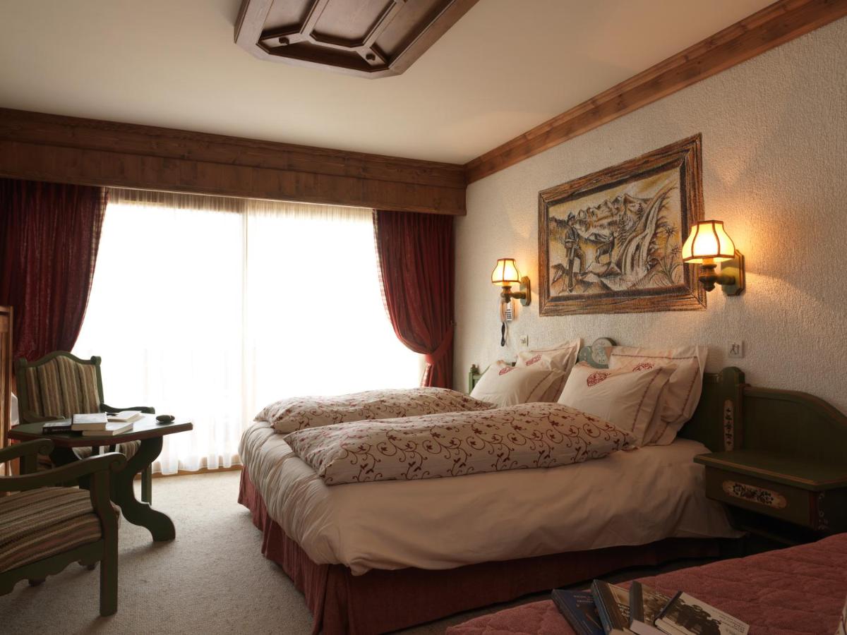 Un ou plusieurs lits dans un hébergement de l'établissement Hôtel Macchi Restaurant & Spa