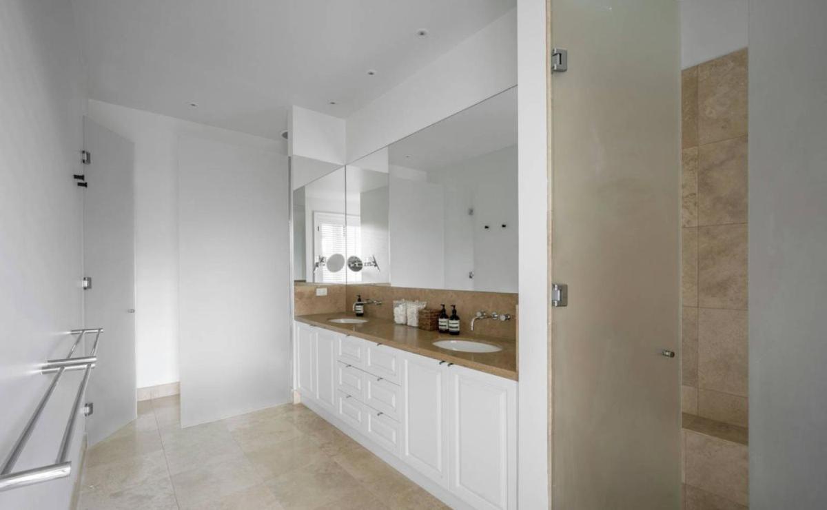 A stunning kitchen featuring marble bench tops - Housity