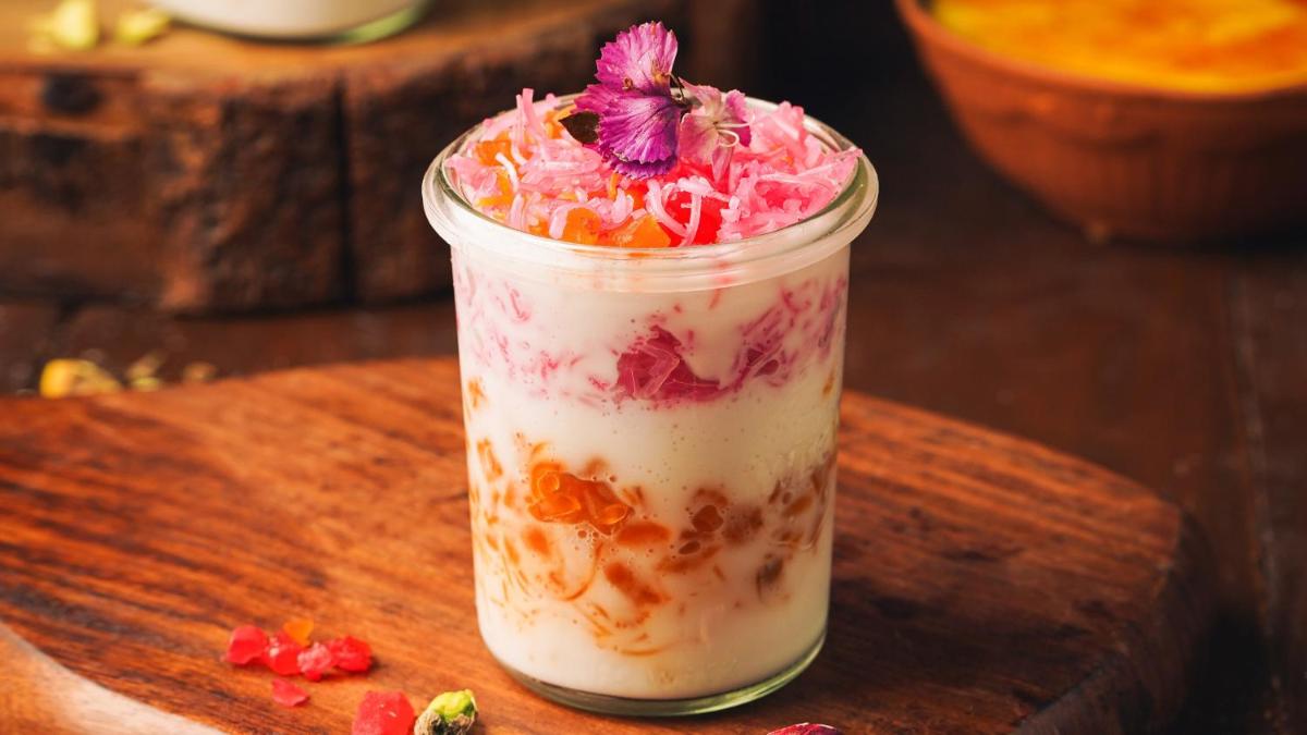a glass jar with a dessert in it on a table at InterContinental Marine Drive Mumbai by IHG in Mumbai