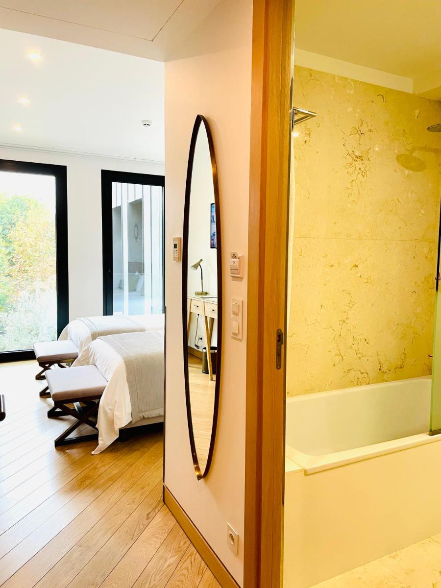 Uma cama ou camas num quarto em Castelo Hotel