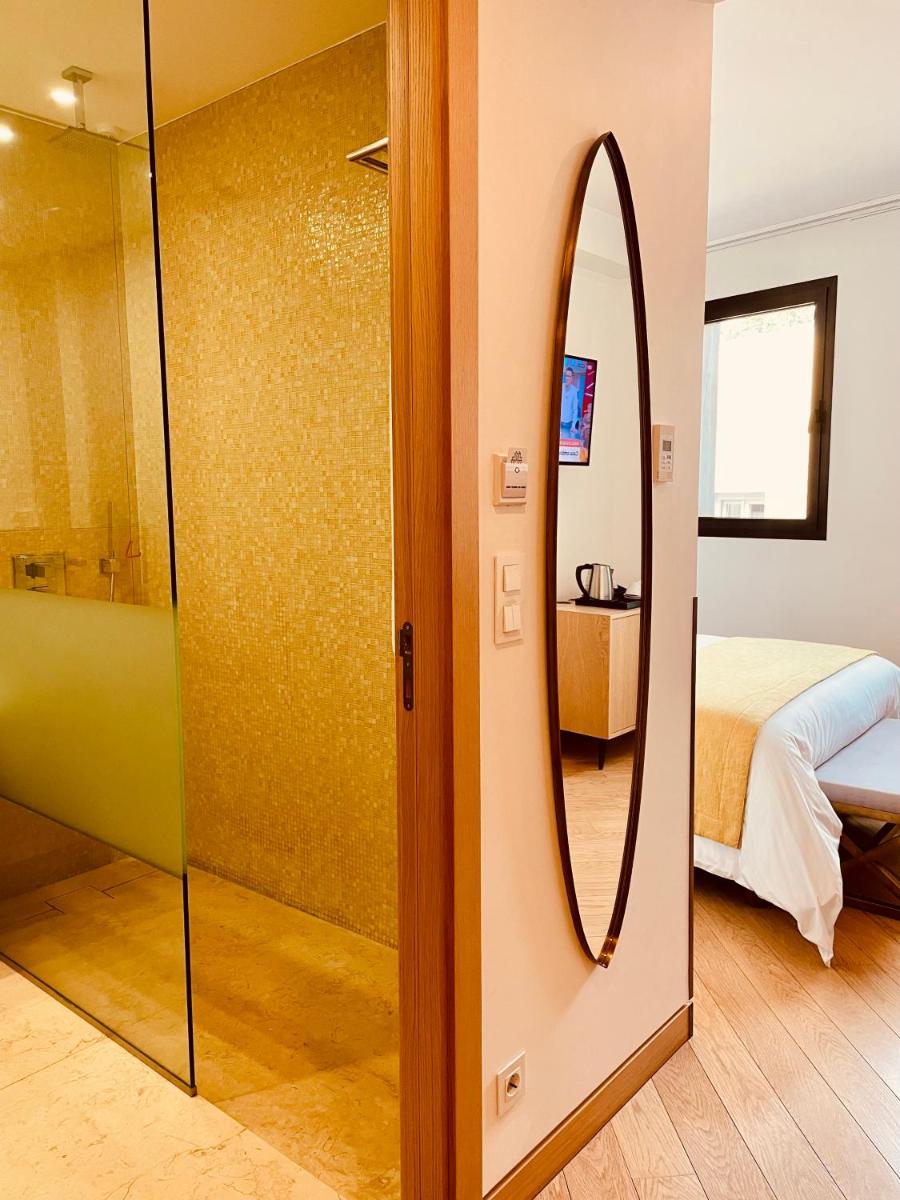 Uma cama ou camas num quarto em Castelo Hotel