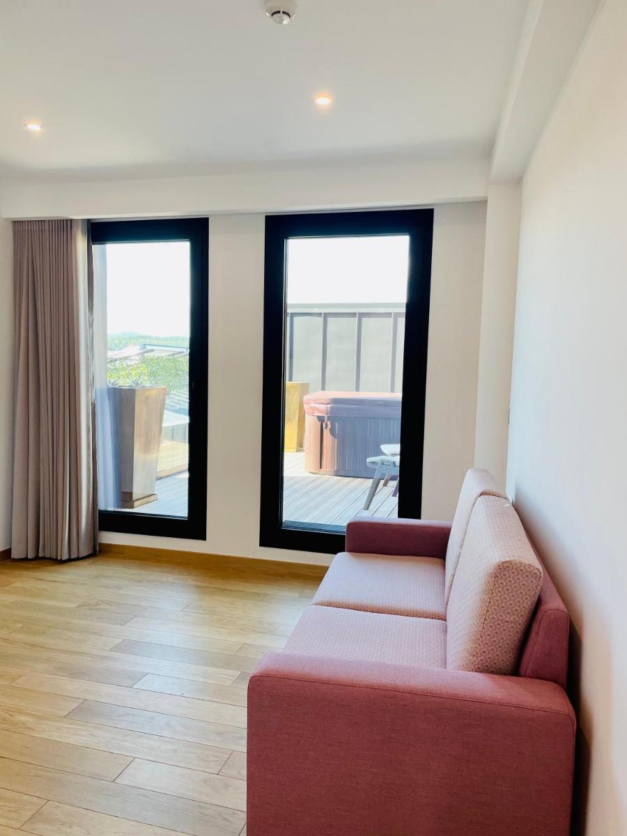 Uma área de estar em Castelo Hotel