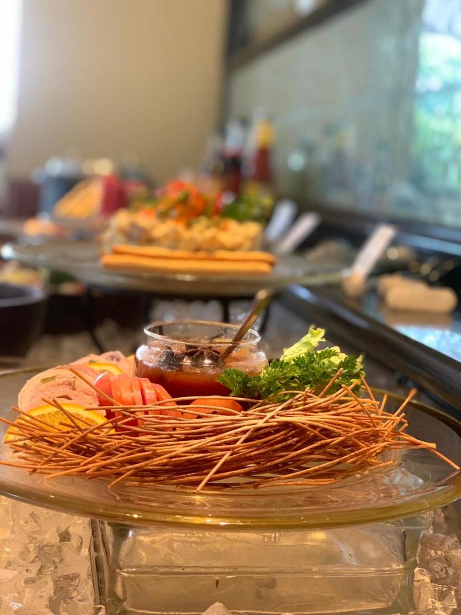 a plate of food sitting on a counter with food at Tajview, Agra-IHCL SeleQtions in Agra