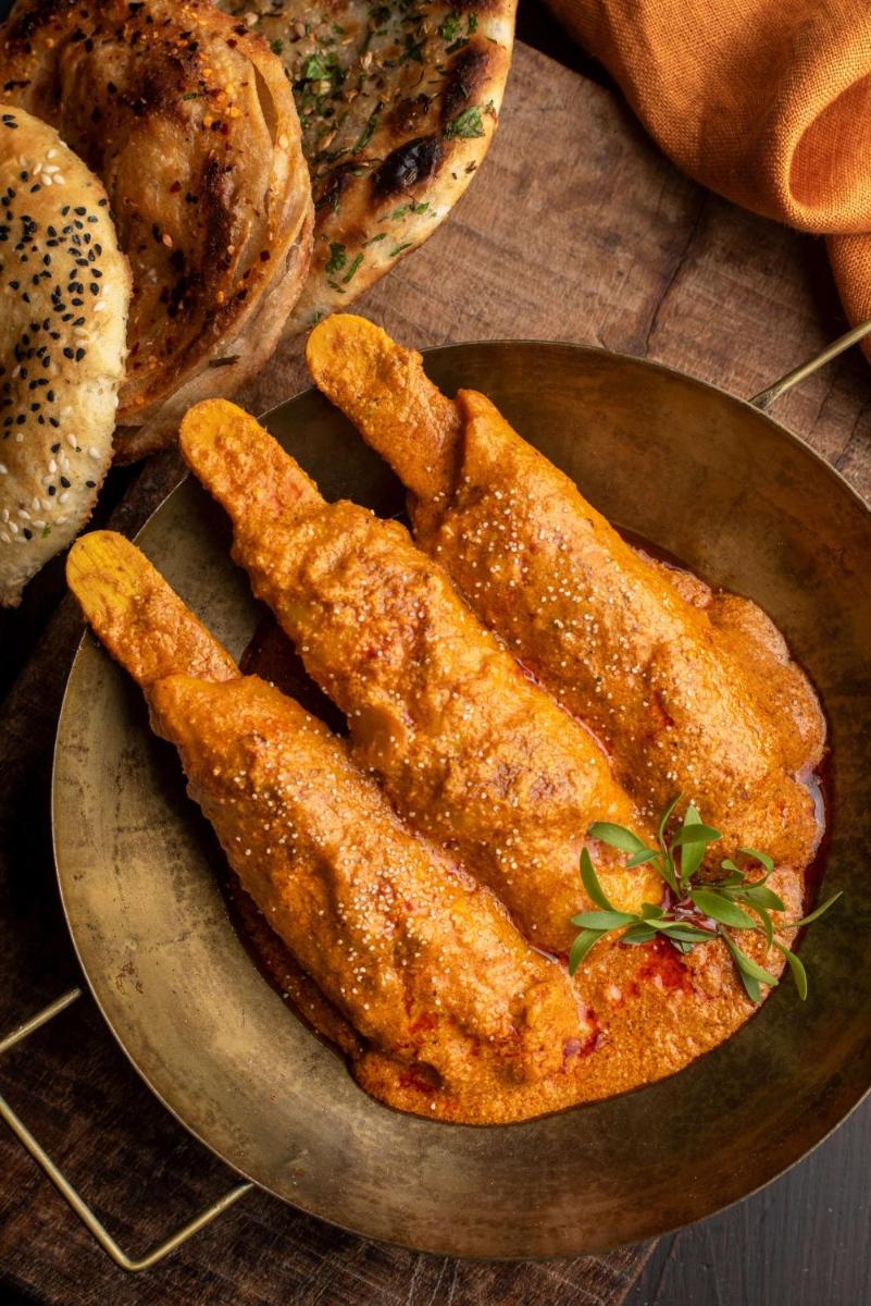 a plate of food with fried food on a table at Radisson Blu Plaza Delhi Airport in New Delhi a plate of food with fried food on a table at Radisson Blu Plaza Delhi Airport in New Delhi