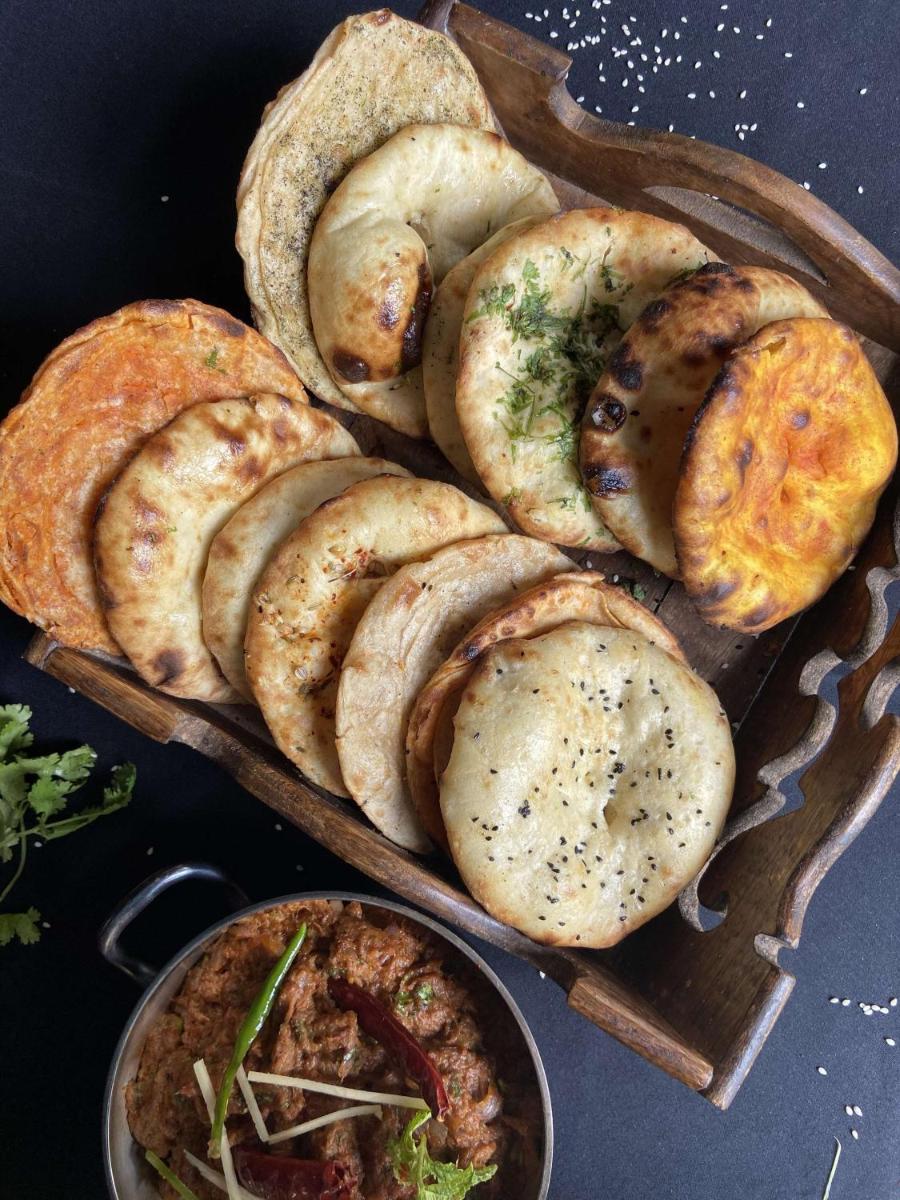 a group of breads and pies on a table at Radisson Blu Plaza Delhi Airport in New Delhi a group of breads and pies on a table at Radisson Blu Plaza Delhi Airport in New Delhi