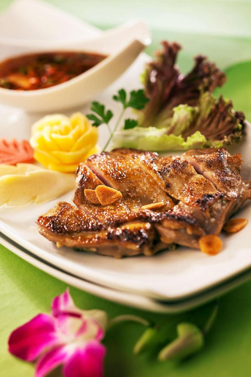 a plate of food with meat and vegetables on a table at Radisson Blu Plaza Delhi Airport in New Delhi a plate of food with meat and vegetables on a table at Radisson Blu Plaza Delhi Airport in New Delhi