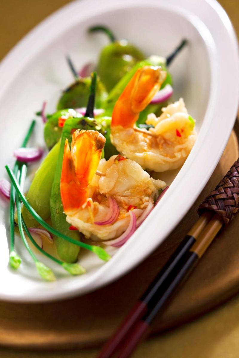 a white bowl of food with shrimp and vegetables at Radisson Blu Plaza Delhi Airport in New Delhi a white bowl of food with shrimp and vegetables at Radisson Blu Plaza Delhi Airport in New Delhi