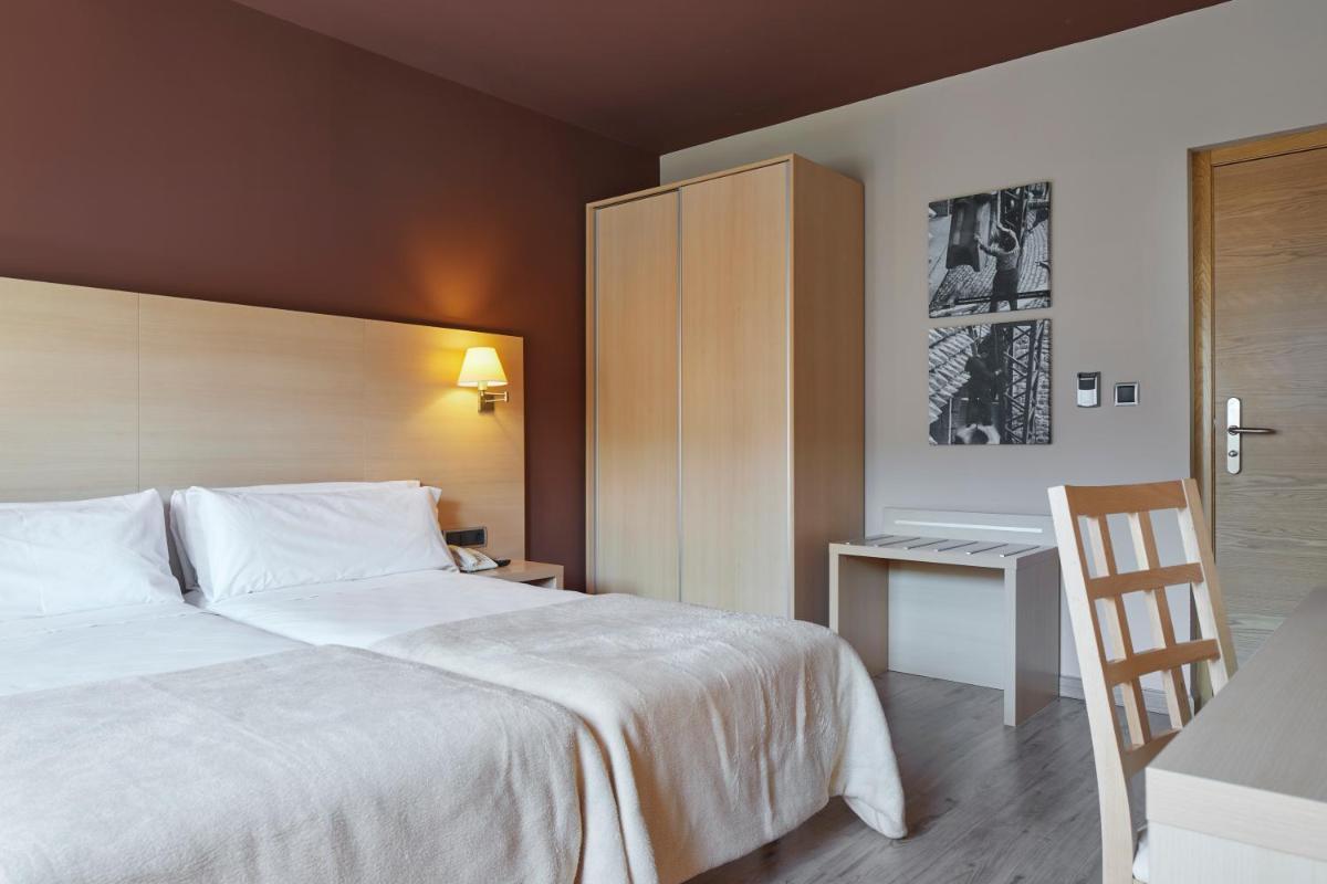 Cama o camas de una habitación en Iraipe Santuario de Arantzazu Hotel