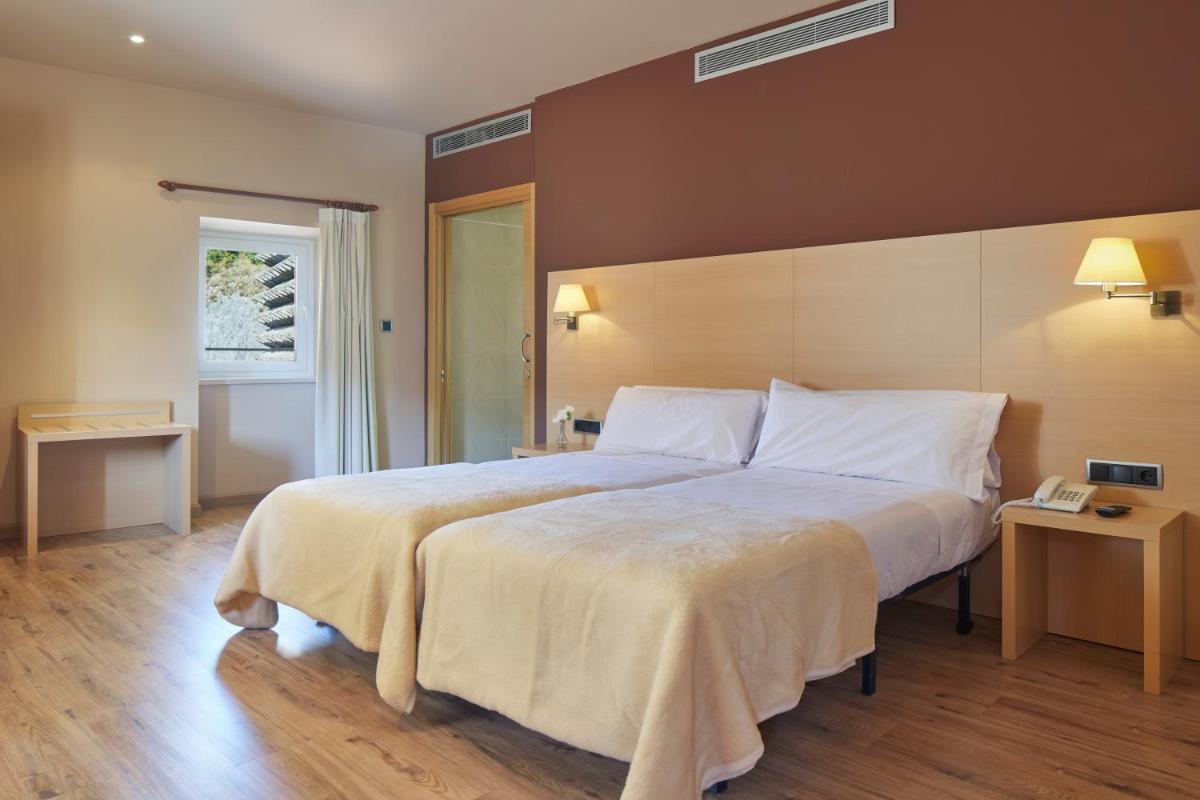 Cama o camas de una habitación en Iraipe Santuario de Arantzazu Hotel