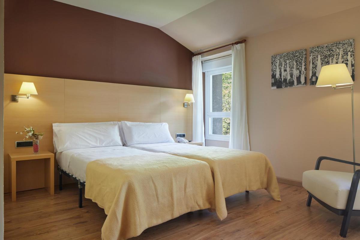 Cama o camas de una habitación en Iraipe Santuario de Arantzazu Hotel
