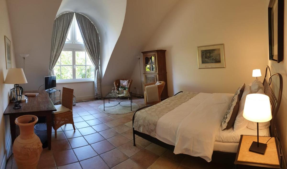 Ein Bett oder Betten in einem Zimmer der Unterkunft Wein- und Landhaus S A Prüm