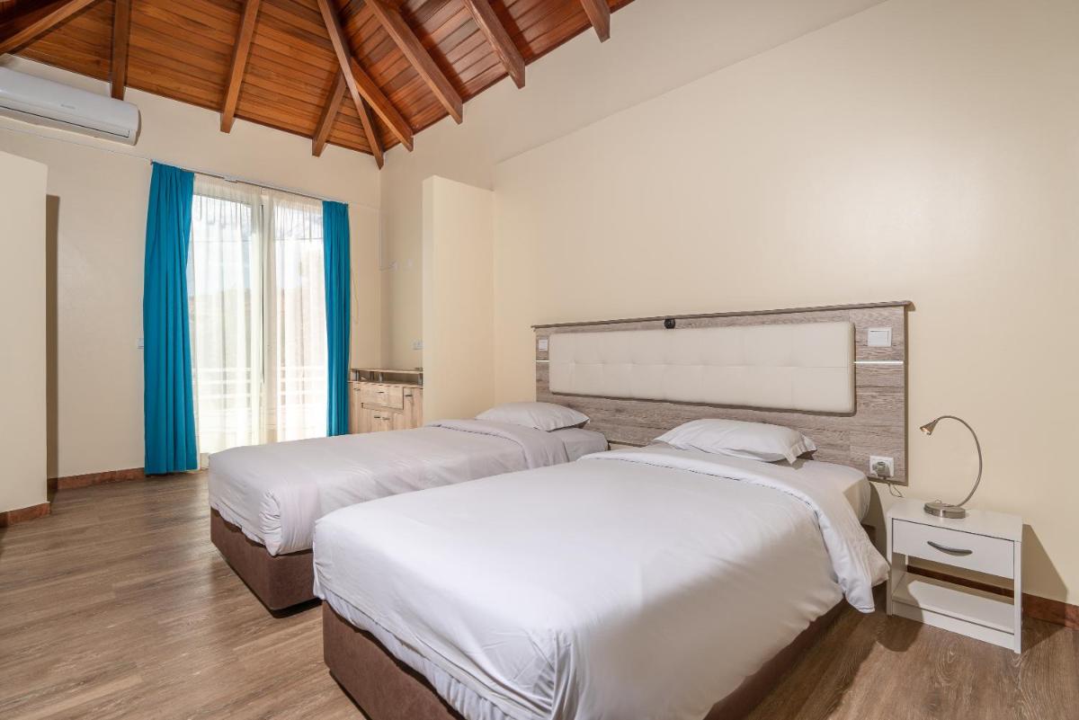 Uma cama ou camas num quarto em TarmarPlace