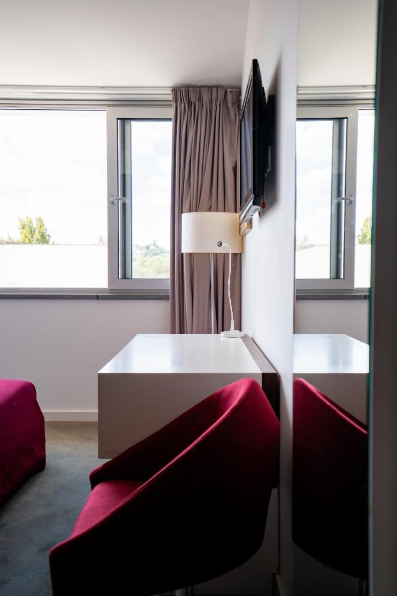Uma cama ou camas num quarto em Hotel Vila D'Óbidos
