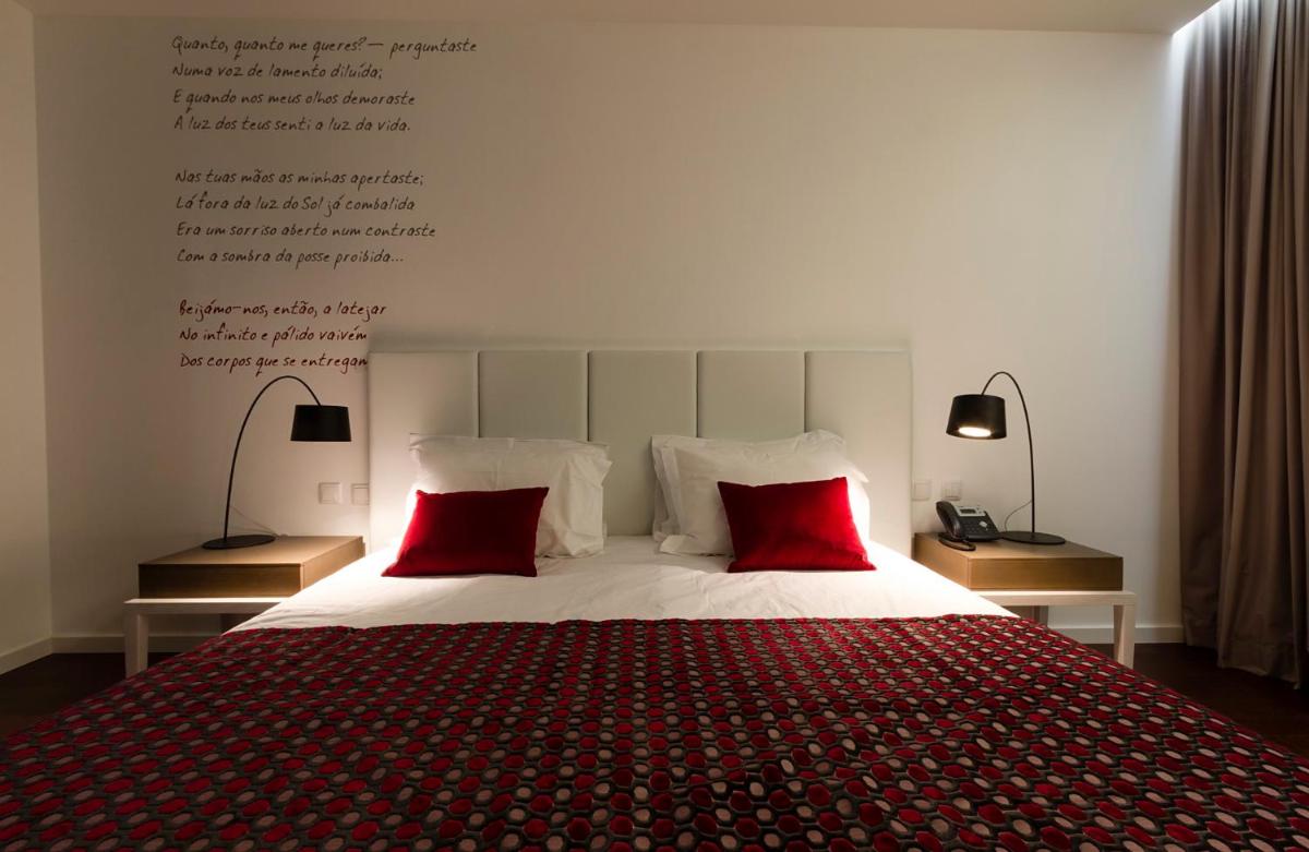 Uma cama ou camas num quarto em Hotel Vila D'Óbidos