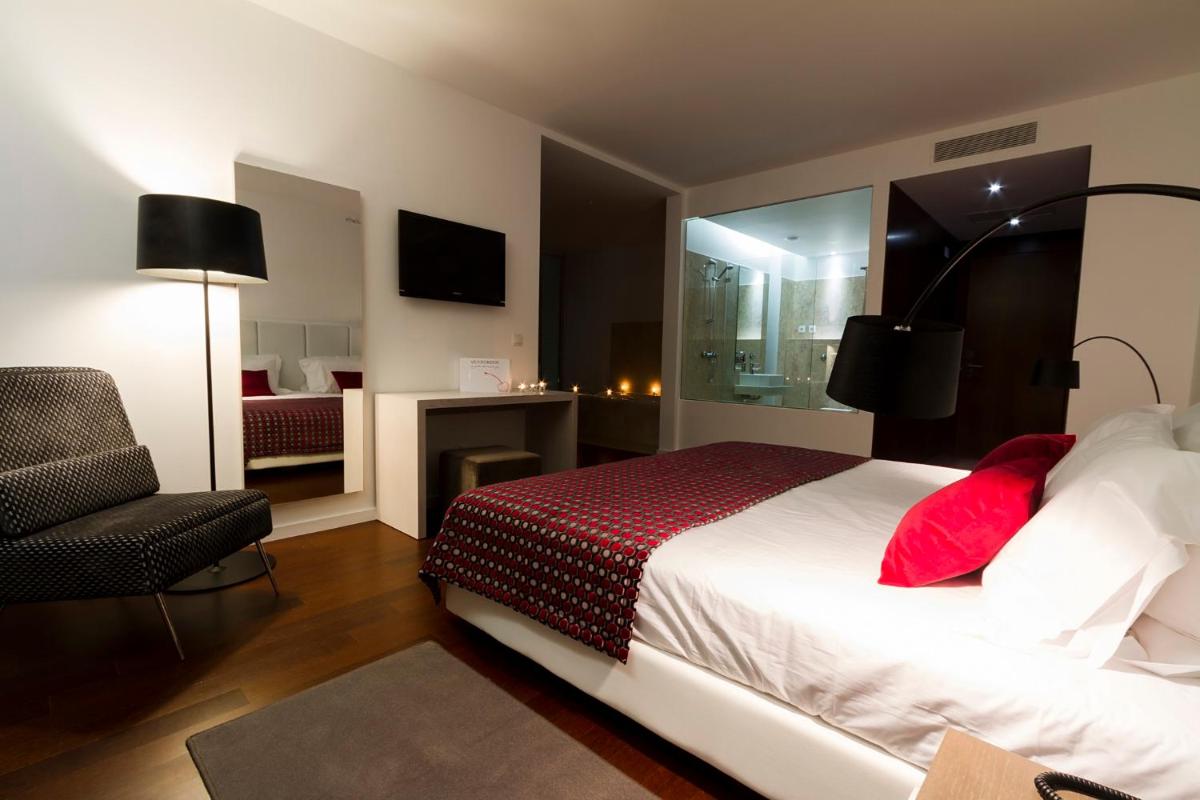 Uma cama ou camas num quarto em Hotel Vila D'Óbidos