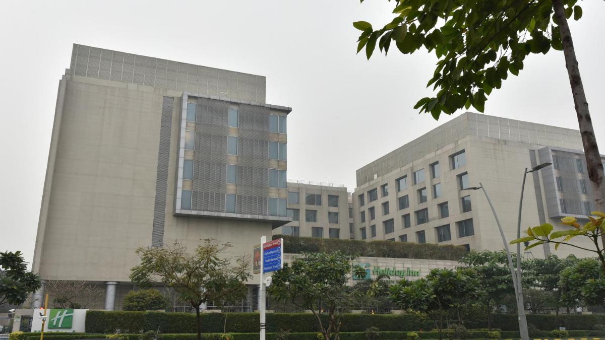 a large office building with two tall buildings at Holiday Inn New Delhi Aerocity by IHG in New Delhi