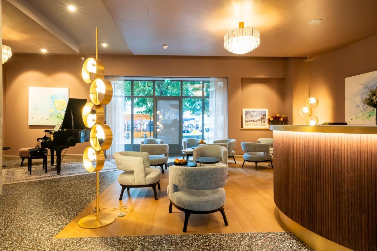 Coin salon dans l'établissement L'INVITATION AU VOYAGE - Hôtel & Spa