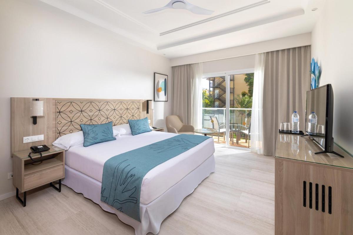 Uma cama ou camas num quarto em Hotel Riu Madeira - All Inclusive