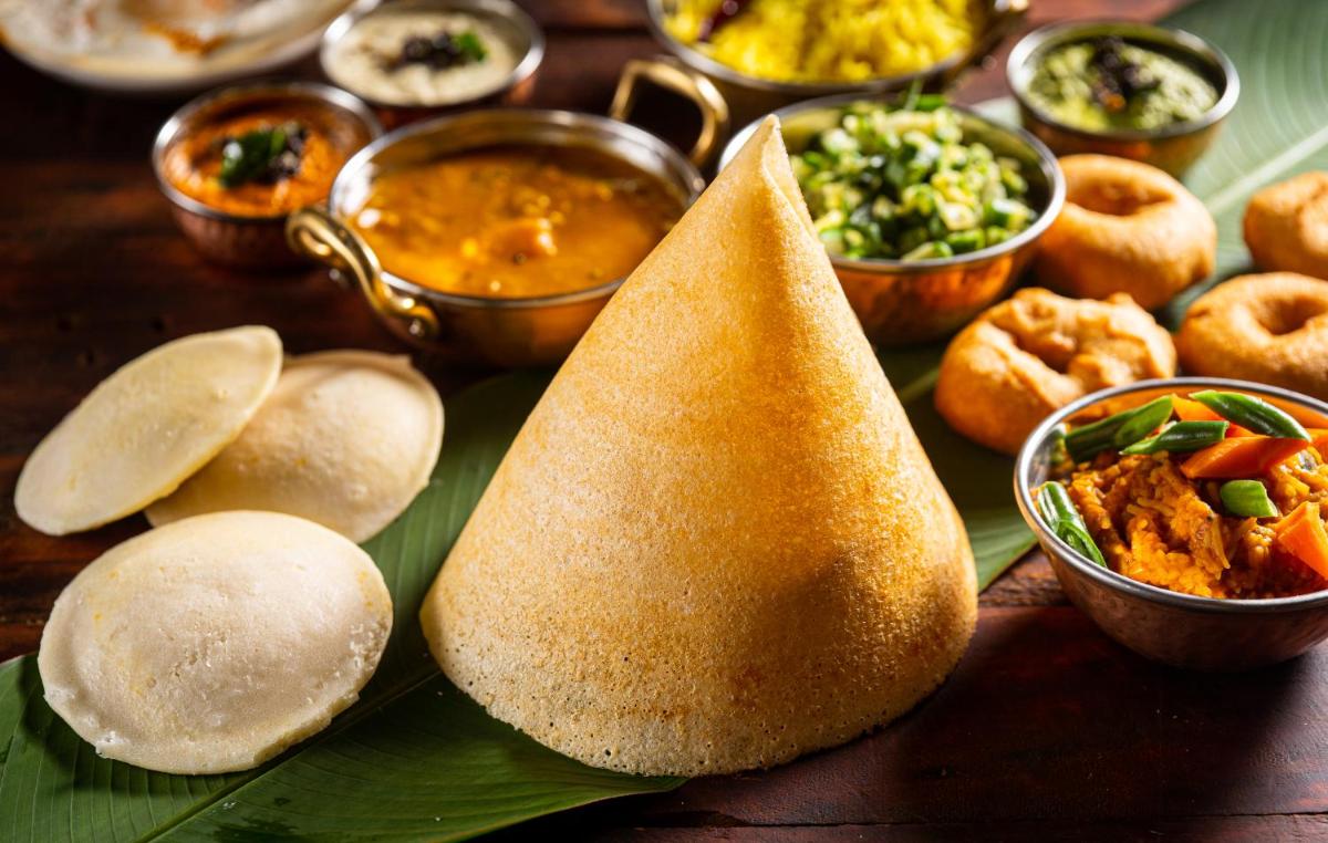 a plate of food with pita bread and other foods at Hyatt Place Jaipur Malviya Nagar in Jaipur a plate of food with pita bread and other foods at Hyatt Place Jaipur Malviya Nagar in Jaipur