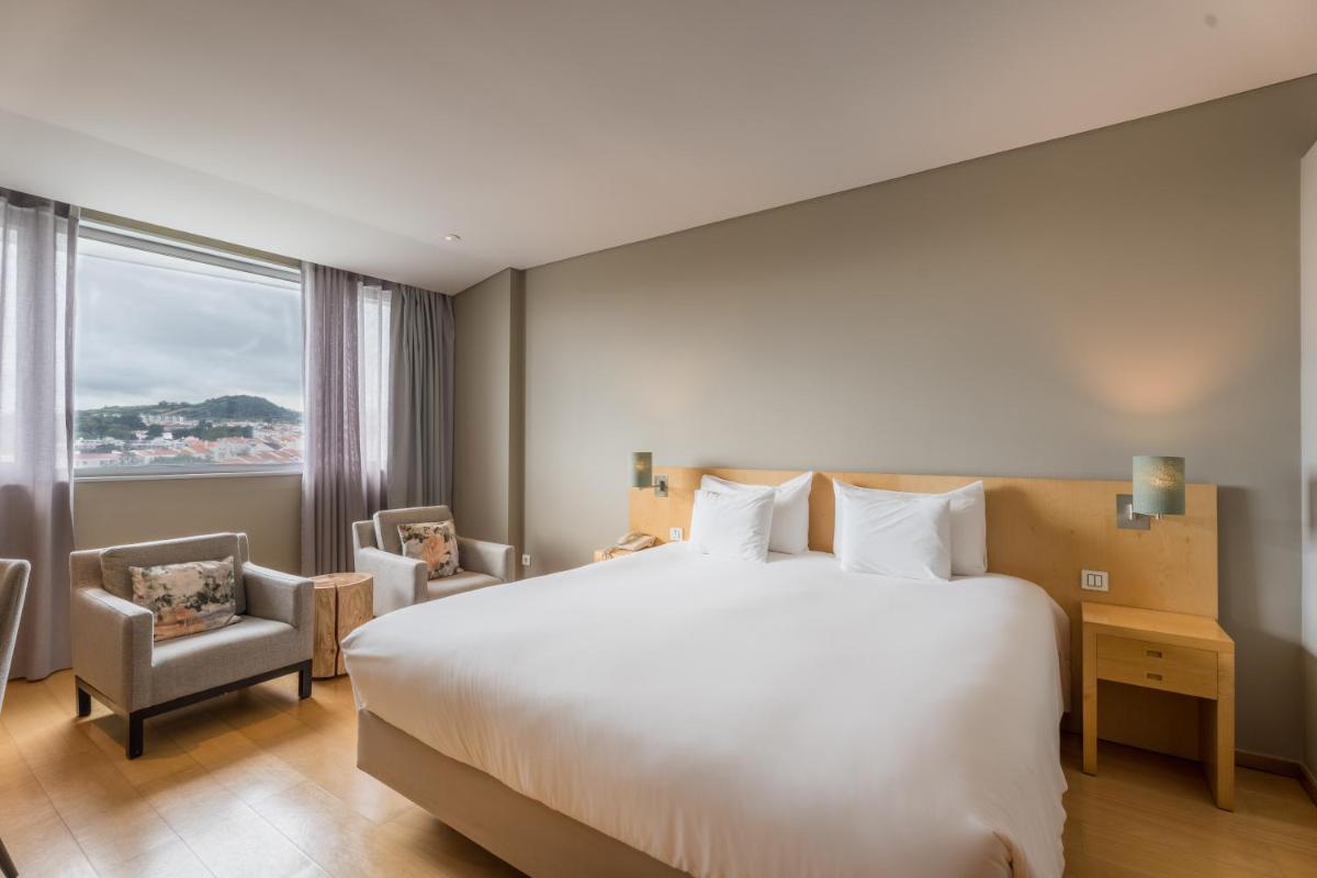 Uma cama ou camas num quarto em The Lince Azores