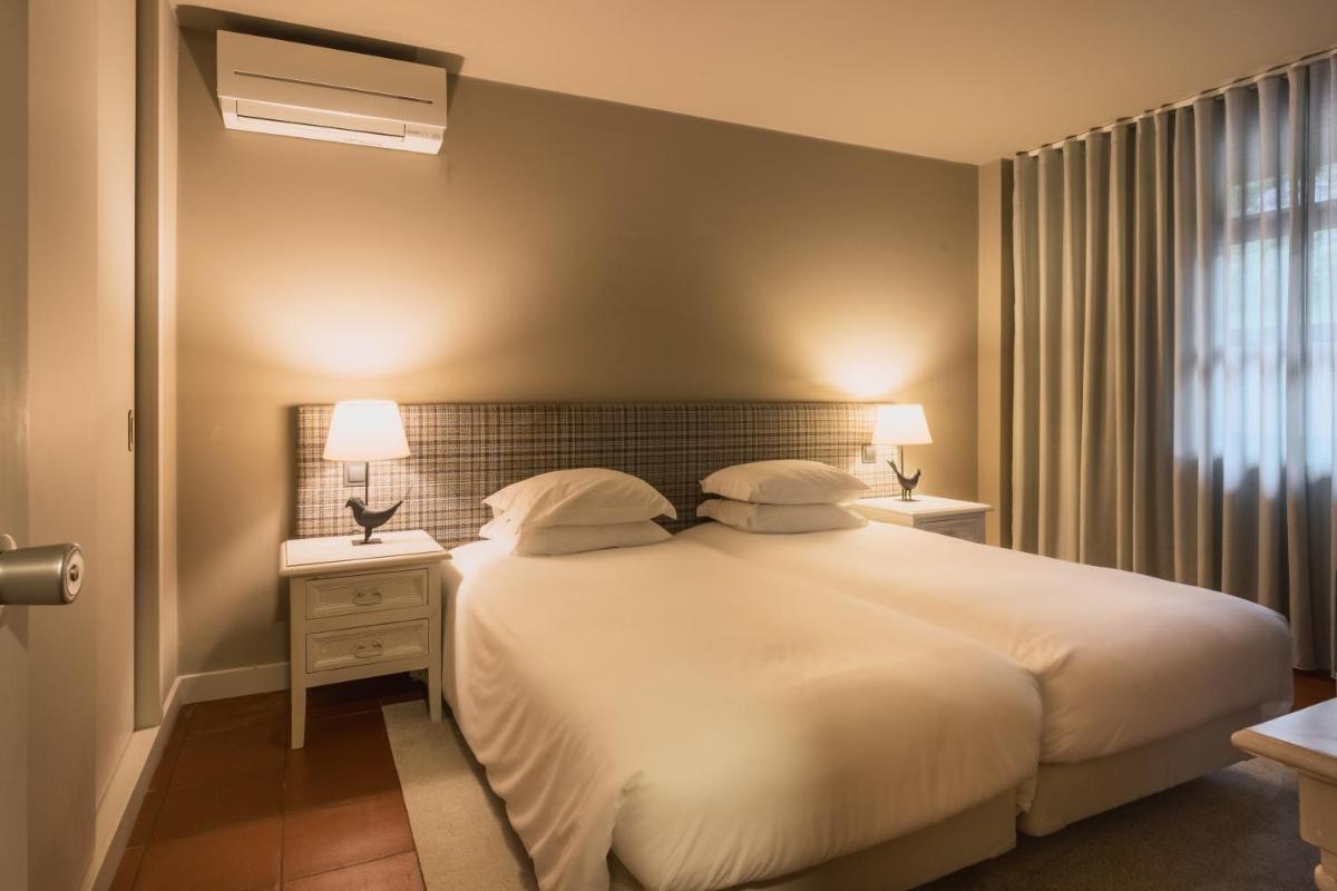 Uma cama ou camas num quarto em The Lince Nordeste