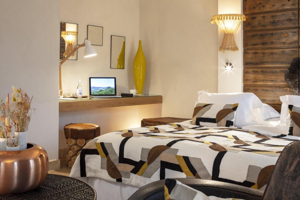 Un ou plusieurs lits dans un hébergement de l'établissement Hôtel La Dimora & Spa