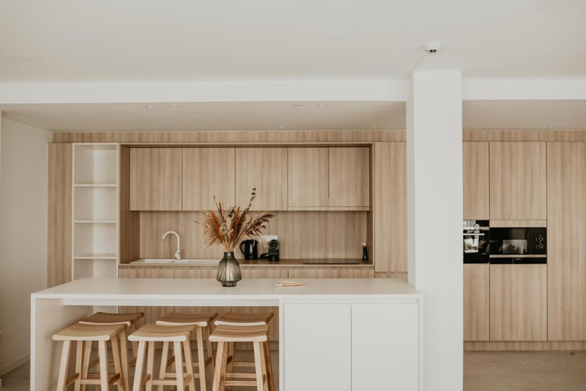 Una cocina o zona de cocina en Portomar Apartments - 4-Star Superior Hotel