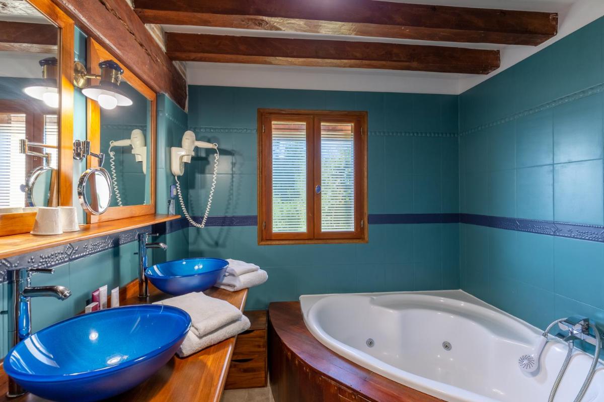 Salle de bains dans l'établissement Demeures & Châteaux Hôtel Domaine le Clos des Fontaines