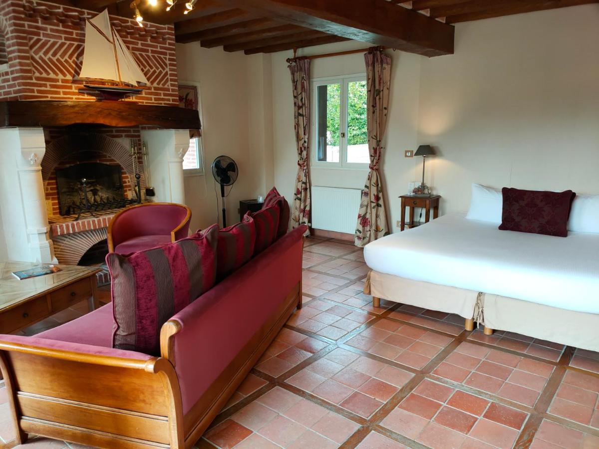 Coin salon dans l'établissement Demeures & Châteaux Hôtel Domaine le Clos des Fontaines