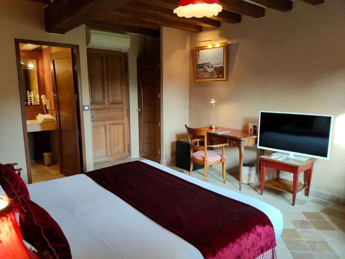 Télévision ou salle de divertissement dans l'établissement Demeures & Châteaux Hôtel Domaine le Clos des Fontaines