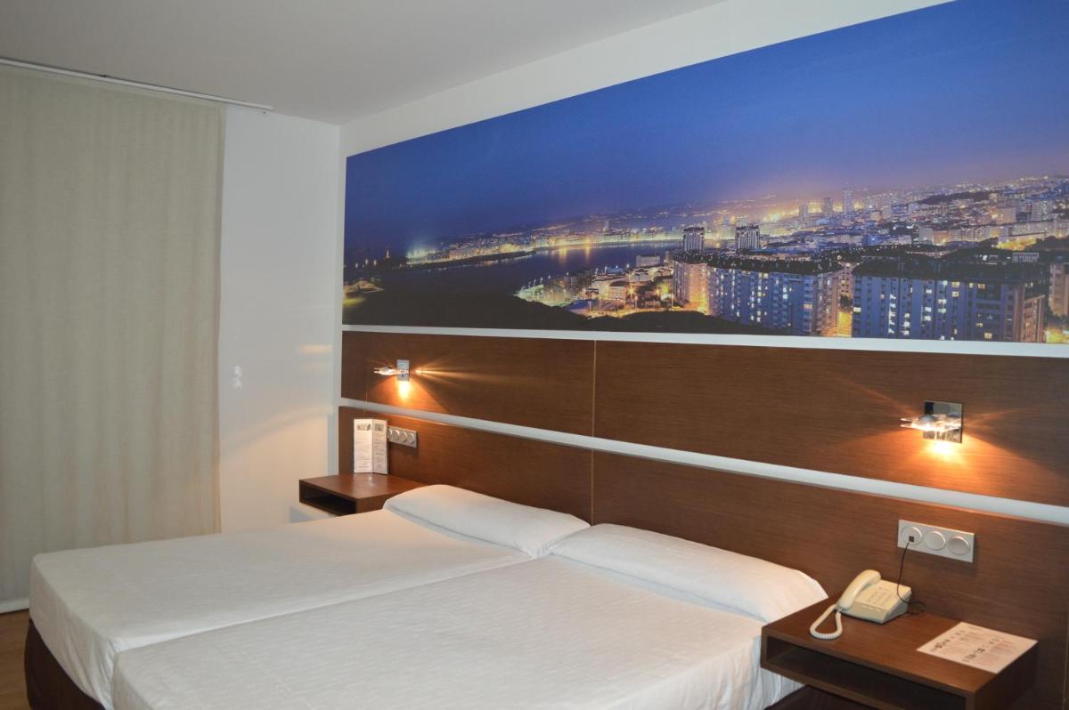 Cama o camas de una habitación en Hotel Spa Odeón