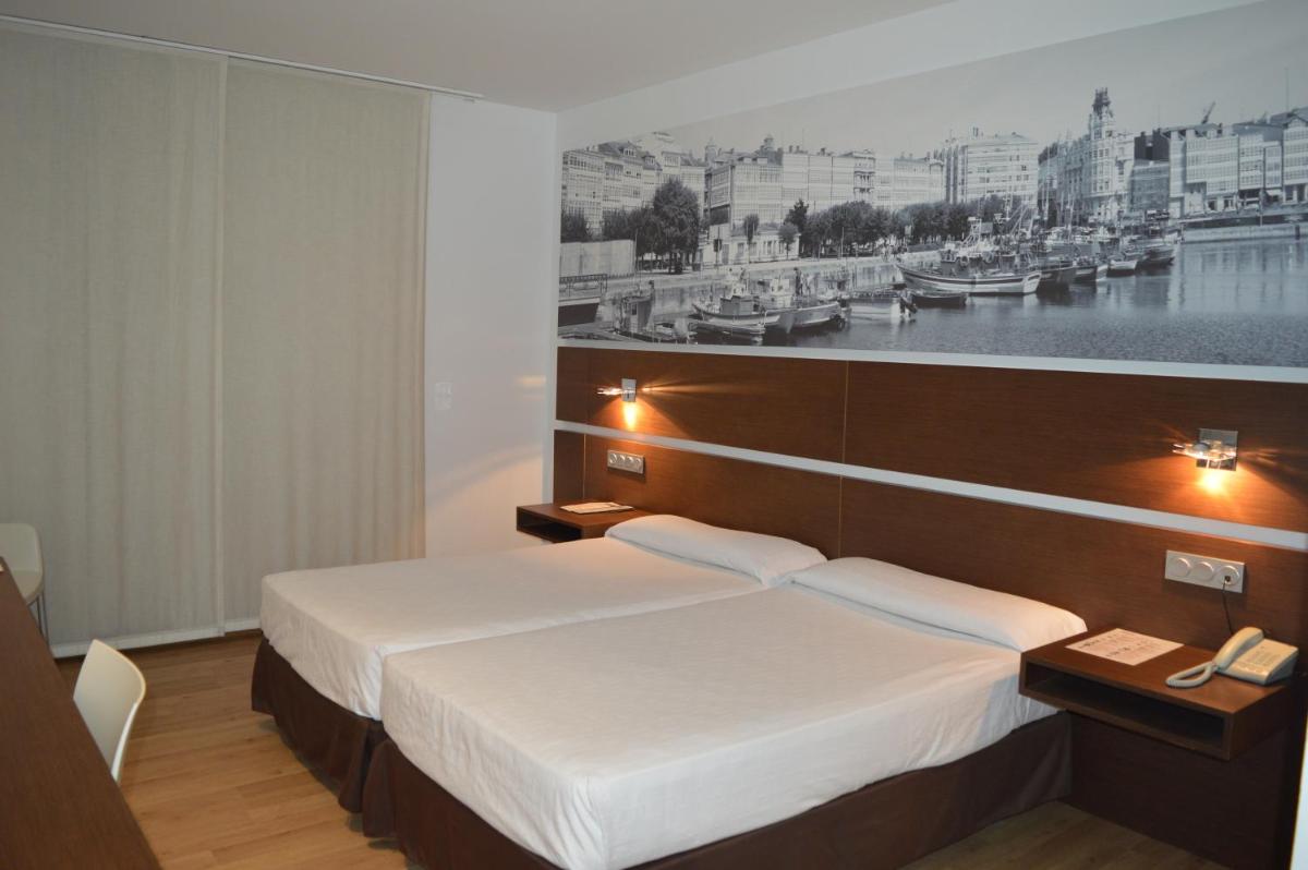 Cama o camas de una habitación en Hotel Spa Odeón