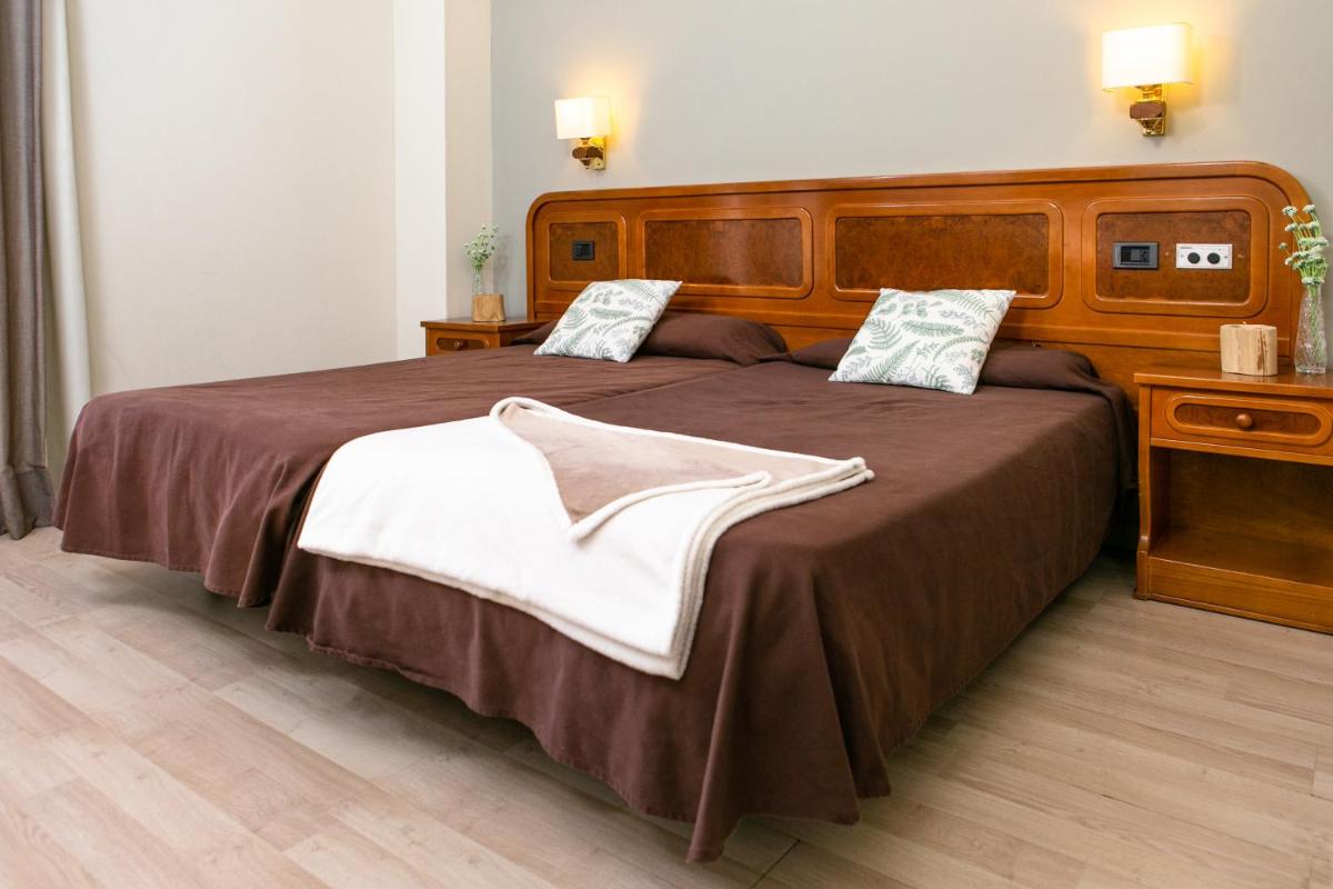 Cama o camas de una habitación en Hotel Snö Condes del Pallars
