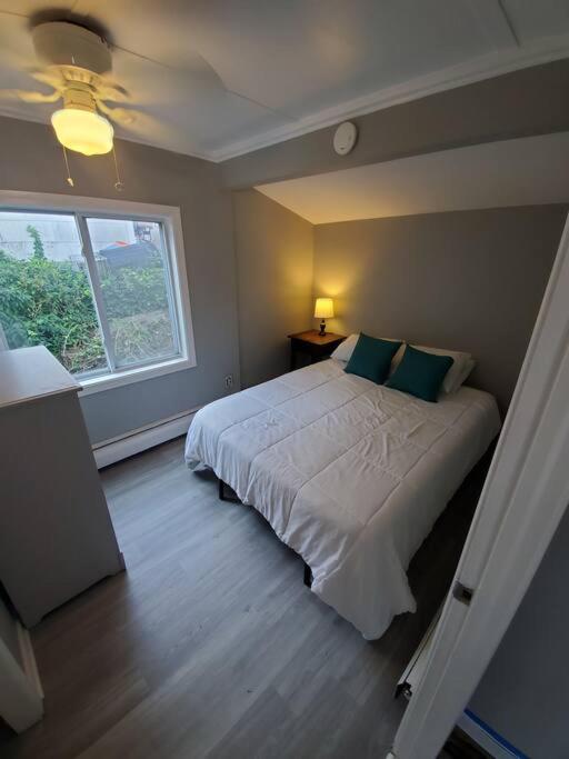 Beachy Bay Breeze Bungalow 2BR with parking and close to many amenities. - Housity