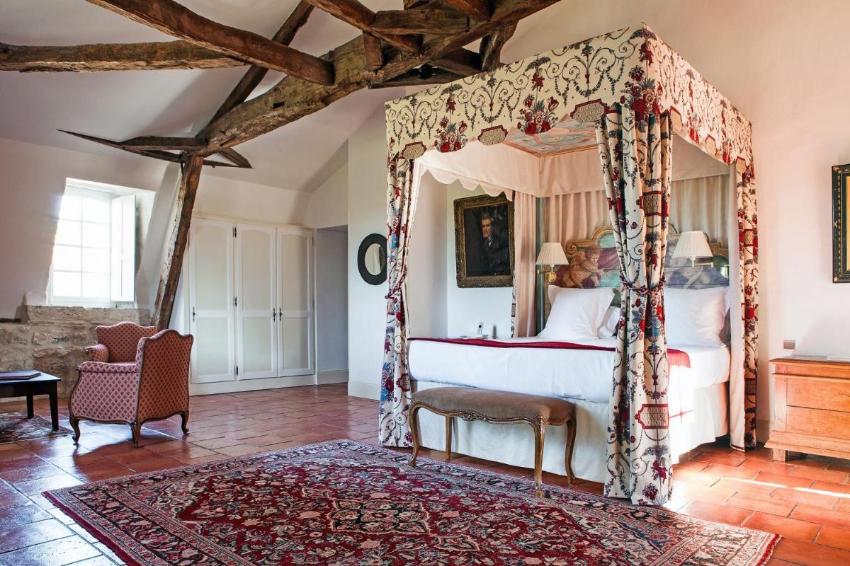 Un ou plusieurs lits dans un hébergement de l'établissement Château des Vigiers