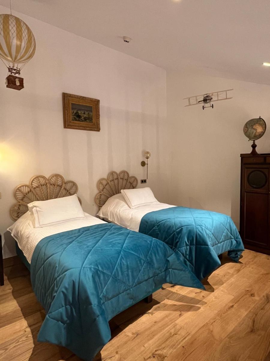 Un ou plusieurs lits dans un hébergement de l'établissement Hôtel du Domaine de La Grange de Condé