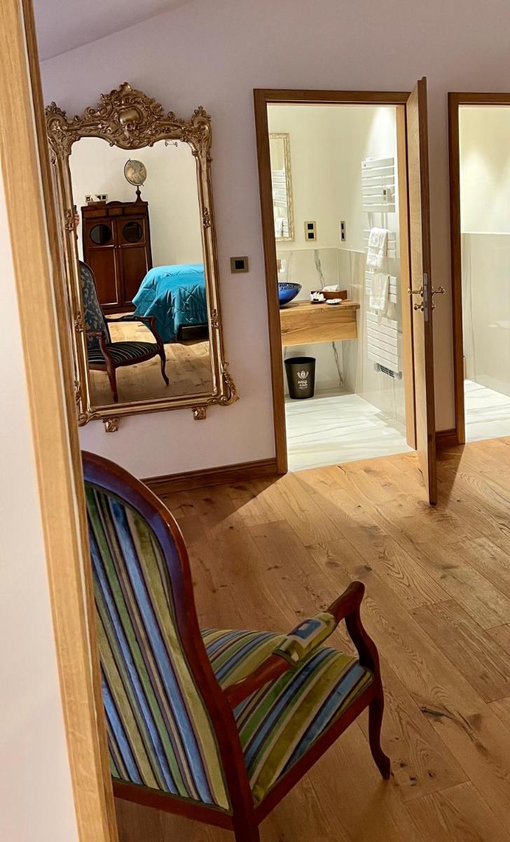 Un ou plusieurs lits dans un hébergement de l'établissement Hôtel du Domaine de La Grange de Condé