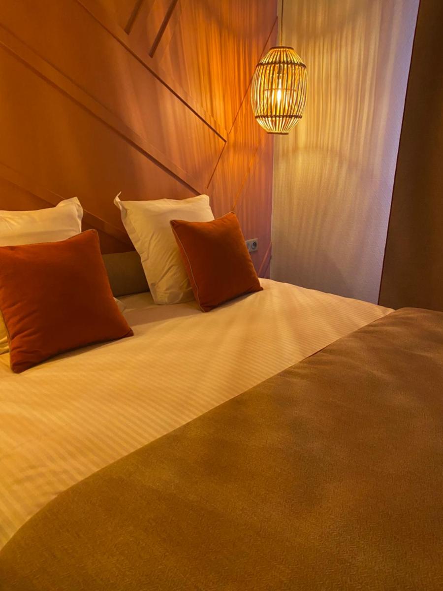 Un ou plusieurs lits dans un hébergement de l'établissement Hotel Normandy