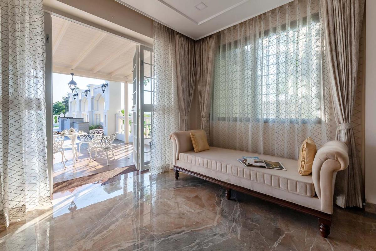 StayVista's Lake La Vie - Tranquil Lake-View Villa Amidst Farmland with Pool and Poolside Gazebo - Proximity to Sula - Hizvo