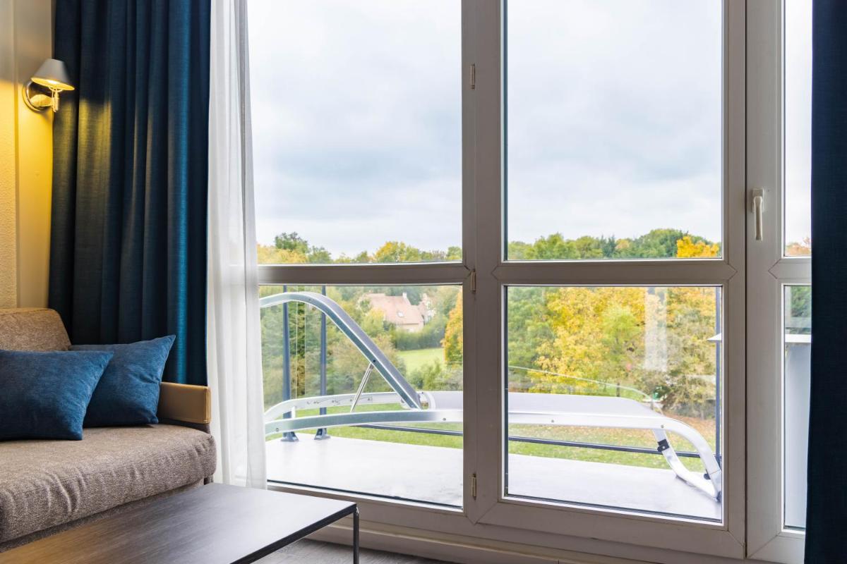 Balcon ou terrasse dans l'établissement Novotel Senart Golf De Greenparc