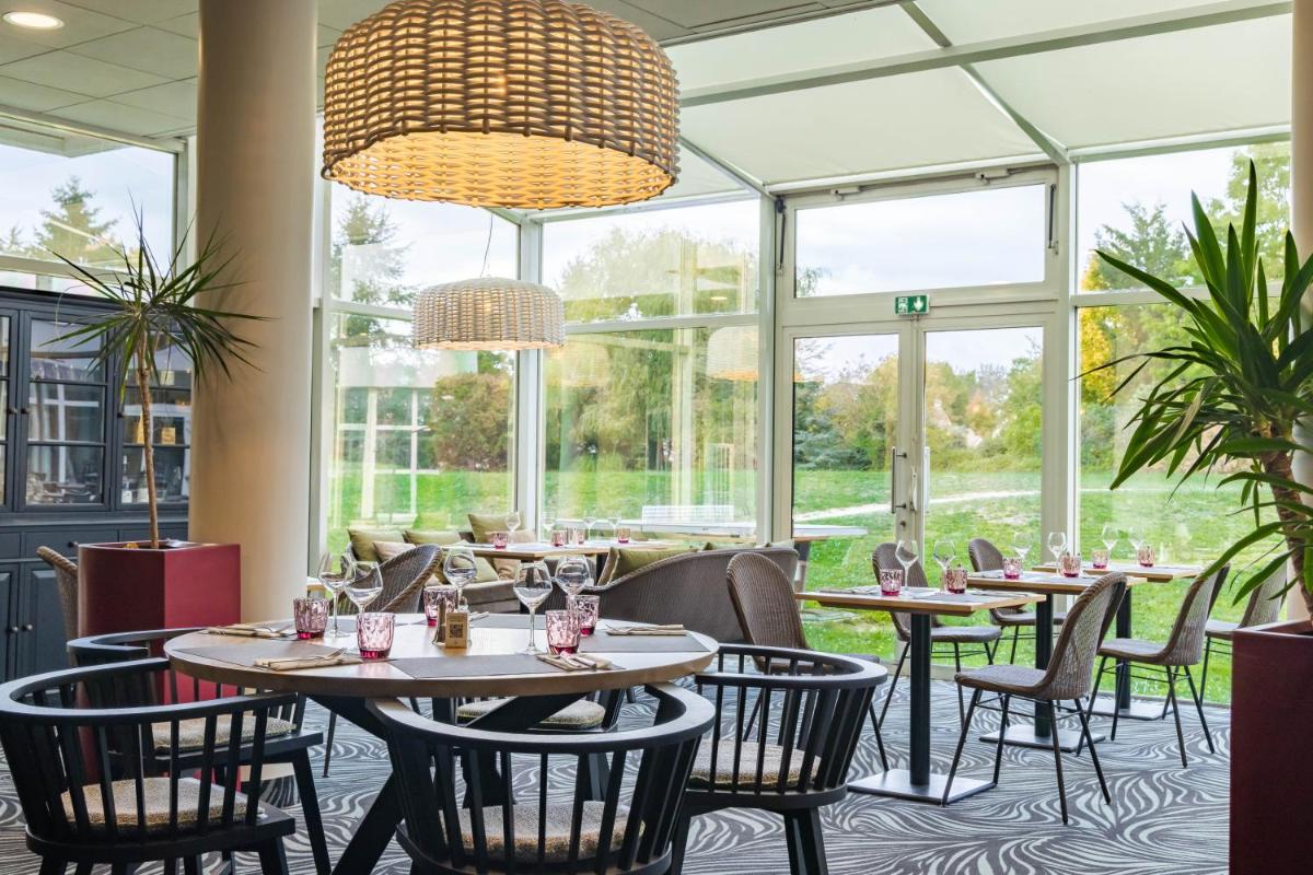 Coin salon dans l'établissement Novotel Senart Golf De Greenparc
