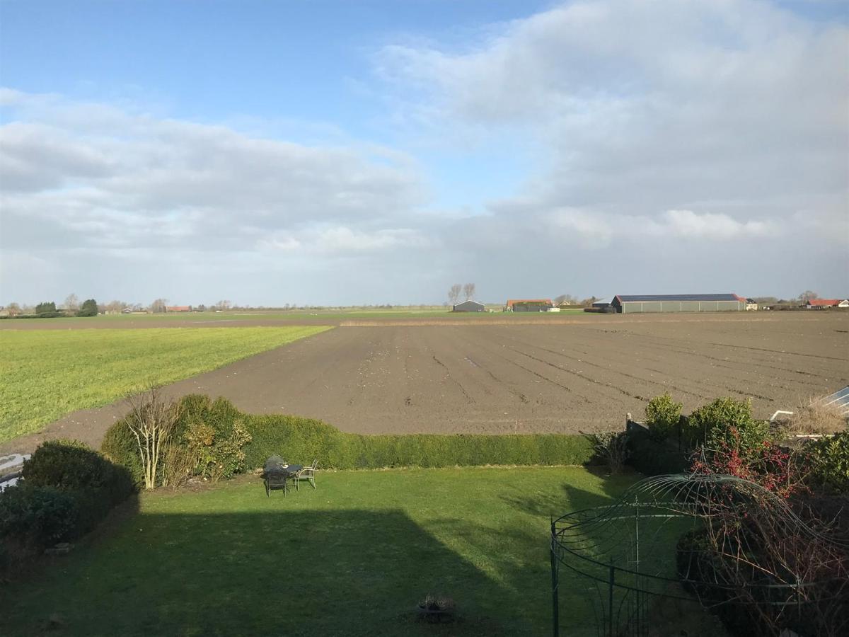 T Huuske tuinappartement met fantastisch uitzicht, nabij Zee - Housity