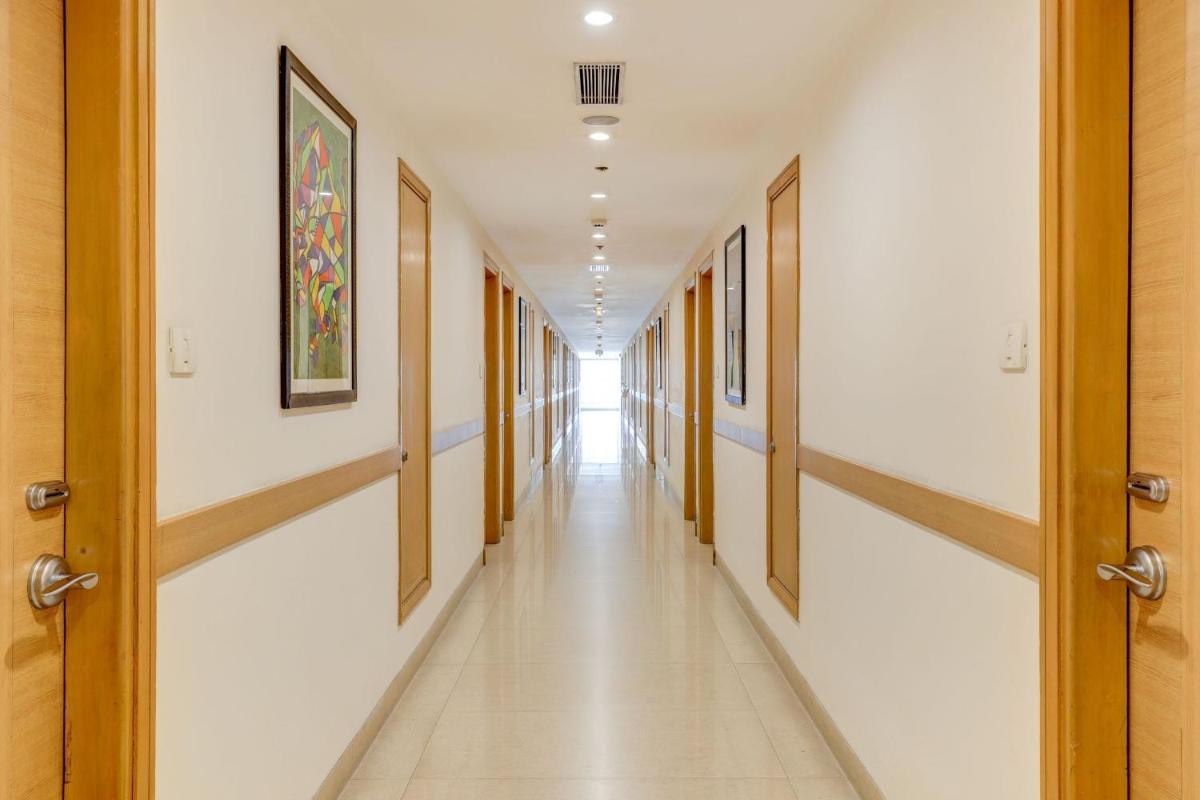 a corridor of a hospital with at Lemon Tree Premier, Delhi Airport in New Delhi a corridor of a hospital with at Lemon Tree Premier, Delhi Airport in New Delhi