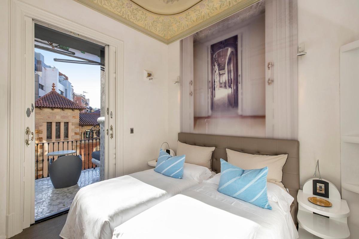 Cama o camas de una habitación en El Palauet Royal Suites