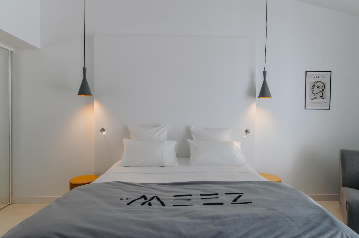 Un ou plusieurs lits dans un hébergement de l'établissement Le Meez